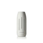 AromaTech difusor frontal blanco piedra mostrando diseño elegante y beneficio estético