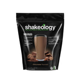 Envase Beachbody Shakeology Chocolate vista frontal mostrando marca y sabor para elección rápida