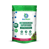 BioTrust envase Metabo Greens frente mostrando sello GMP y sabor berry