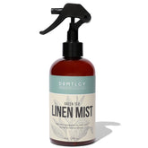 DRMTLGY botella frontal mostrando etiqueta y beneficios naturales