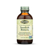 Flora Swedish Bitters vista frontal con botella ámbar y etiqueta clara, conserva sabor tradicional