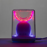 Generic dispositivo portátil frontal mostrando la pieza bucal y conectividad USB para conveniencia