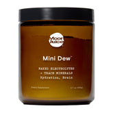 Moon Juice frasco Mini Dew al frente mostrando envase reutilizable y beneficios sustentables