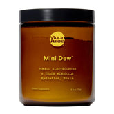Moon Juice frasco Mini Dew frente mostrando la etiqueta y beneficios