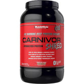 MuscleMeds Carnivor Shred frente del envase mostrando el sabor chocolate y beneficio proteico