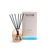 NEOM difusor vista frontal en vidrio ámbar, aporta estilo y aroma duradero