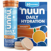 Nuun frente del tubo blueberry tangerine mostrando envase portátil y conveniencia