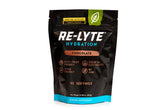 REDMOND envase Re-Lyte de frente, muestra sabor chocolate y beneficios de electrolitos