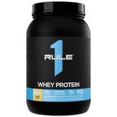 Rule 1 Proteins envase frontal Banana Crème mostrando diseño y porciones