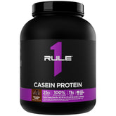 Rule 1 Proteins envase frontal Chocolate Fudge mostrando 52 porciones y beneficio de proteína sostenida