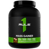 Rule 1 Proteins bote frontal del Mass Gainer mostrando la etiqueta y beneficios claros