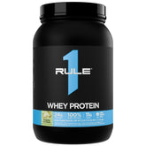 Rule 1 Proteins envase frontal sabor Pistachio Ice Cream mostrando 27 porciones y beneficio práctico