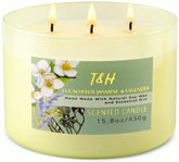 T&H vela frente en vaso verde mostrando etiqueta elegante y aroma equilibrado