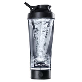 VOLTRX botella frontal mostrando diseño curvado y base luminosa, atractivo visual