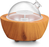 XANAPHIA vista frontal con cubierta de cristal y base efecto madera beneficiando decoración