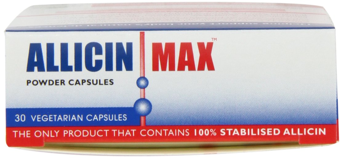 ALLICINMAX cápsula sobre mesa junto a botella de agua en contexto activo