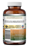 Amazing Nutrition tabletas junto a vaso de agua lista para tomar