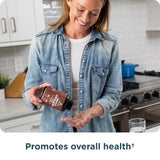 Ancient Nutrition cápsulas junto a regla para comparar tamaño