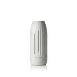 AromaTech difusor frontal blanco piedra mostrando diseño elegante y beneficio estético