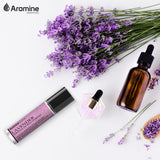 Aromine roll on en bolso y libreta, ideal para uso diario y viaje