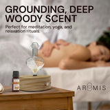ArOmis frasco 10ml junto a una regla para referencia de tamaño