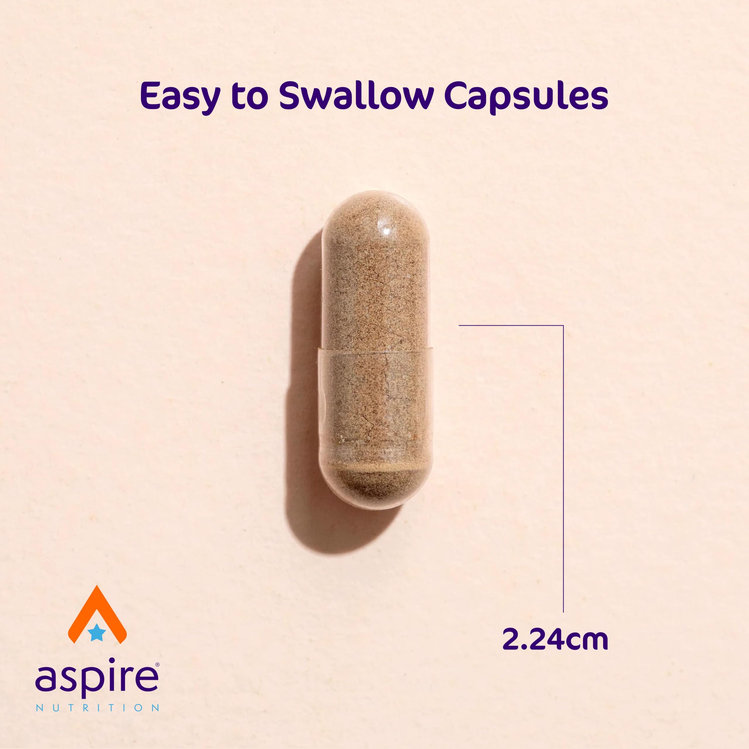 Aspire Nutrition cápsula en mano para comparar tamaño y dosificación