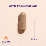 Aspire Nutrition cápsula en mano para comparar tamaño y dosificación