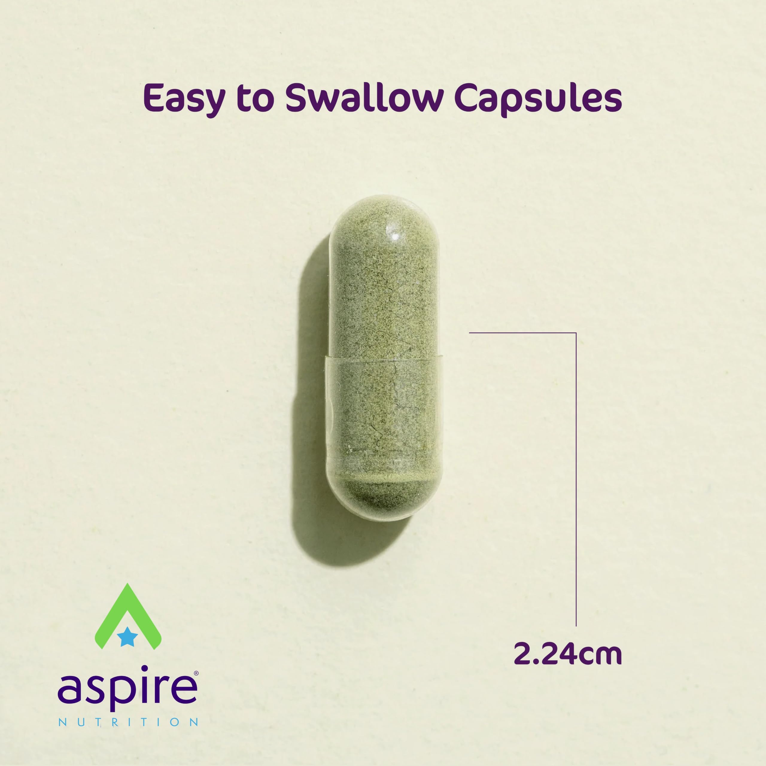 Aspire Nutrition cápsulas junto a una regla para comparar tamaño