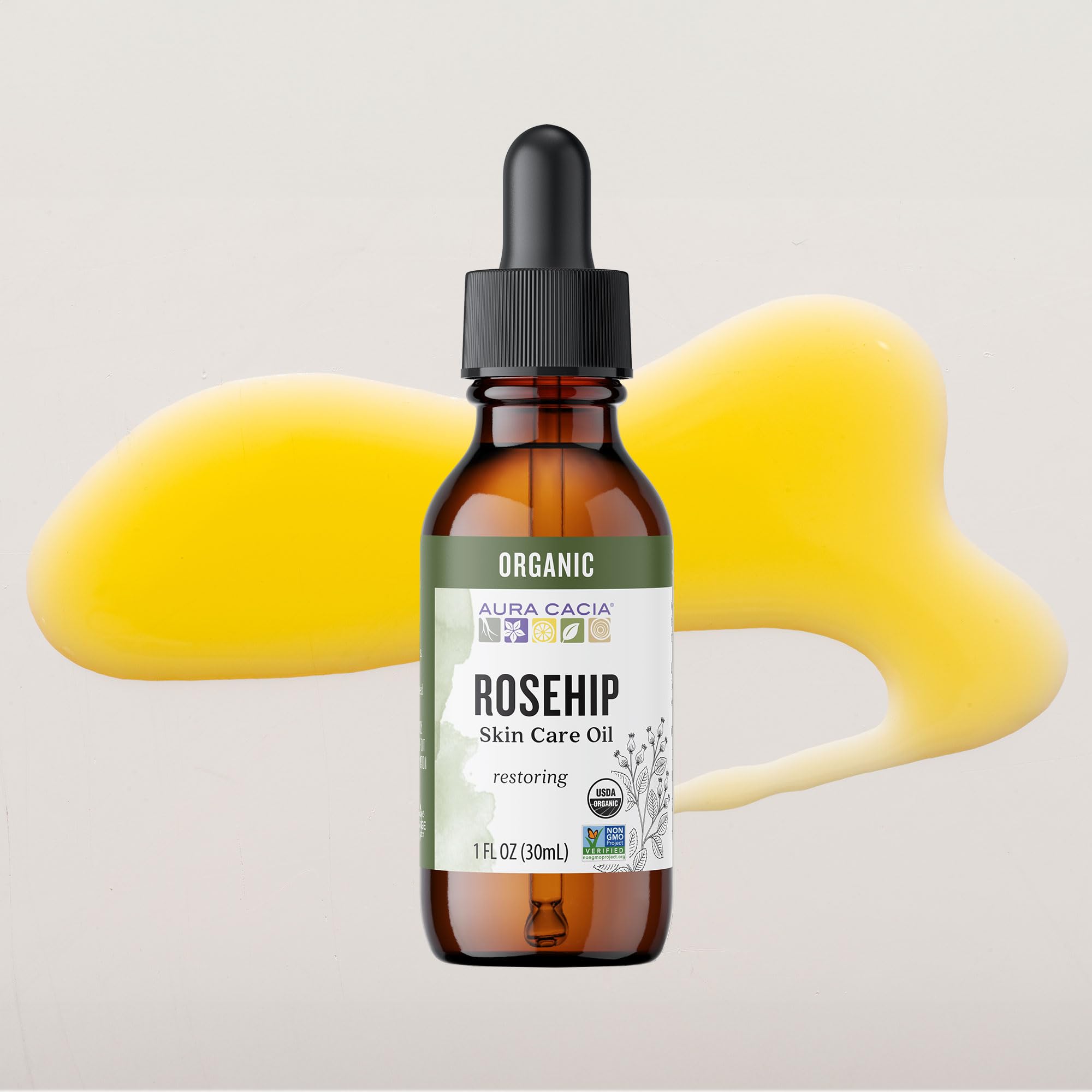 Aura Cacia botella en mano para comparar tamaño y facilitar dosificación
