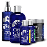 Aussie Trace Minerals junto a mano para comparar tamaño del envase de 60 ml