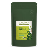 Banyan Botanicals envase frontal de Haritaki mostrando identificación y beneficios