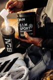 BARE PERFORMANCE NUTRITION frasco junto a mano para comparar tamaño y cantidad de servicios
