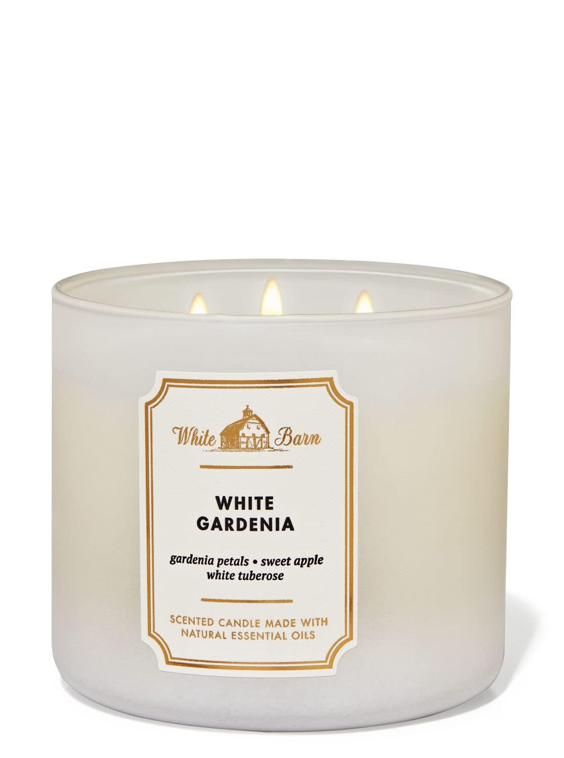 Bath & Body Works vela encendida en sala, crea atmósfera floral y relajante