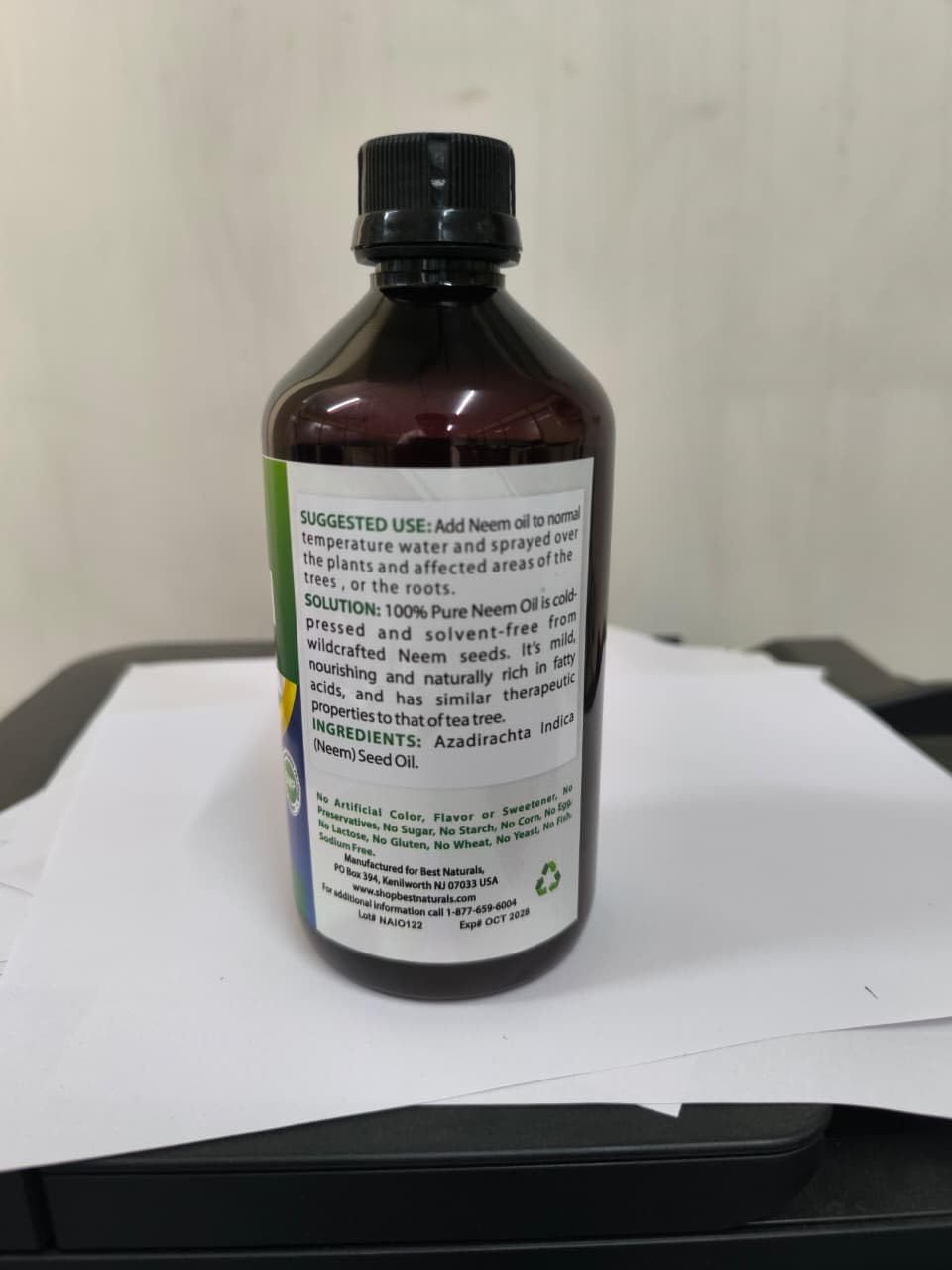 Best Naturals botella junto a una regla para comparar tamaño práctico