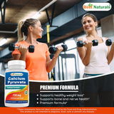 Best Naturals cápsula junto a moneda para comparar tamaño y dosificación