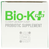 Bio-K Plus cápsulas alineadas en mano para visualizar tamaño y dosificación