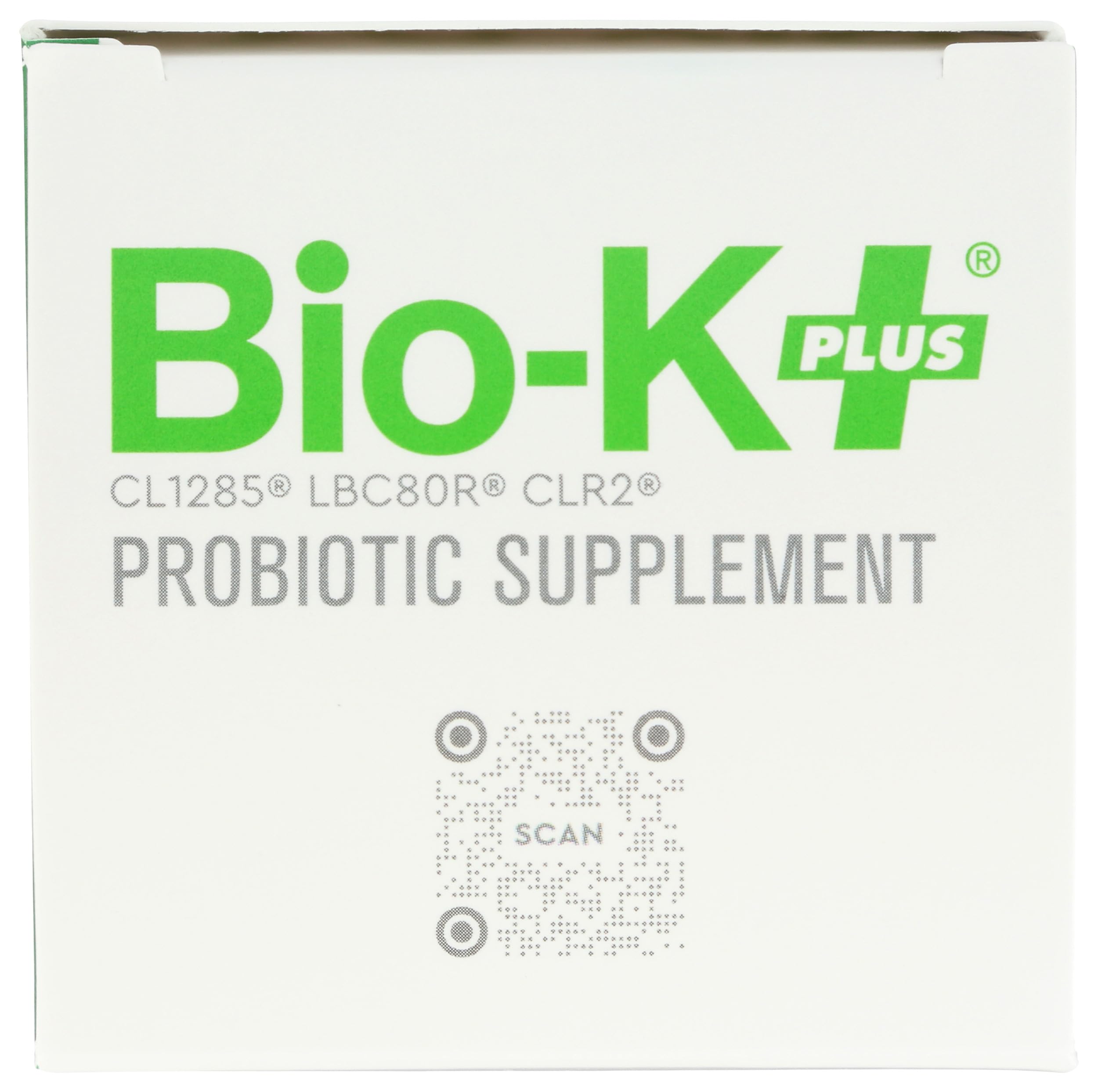 Bio-K Plus comparada con una moneda para ver la escala y portabilidad