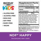 BIORAY Kids NDF Happy gota en gotero resaltando textura líquida y dosificación precisa