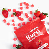 Gominolas Burst Creatine en mano listos para consumo y fácil dosificación
