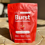 Gominolas Burst Creatine alineadas sobre superficie indicando color y forma