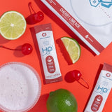 Cellutrex H2O sobre disolviéndose en un vaso con agua para hidratación rápida
