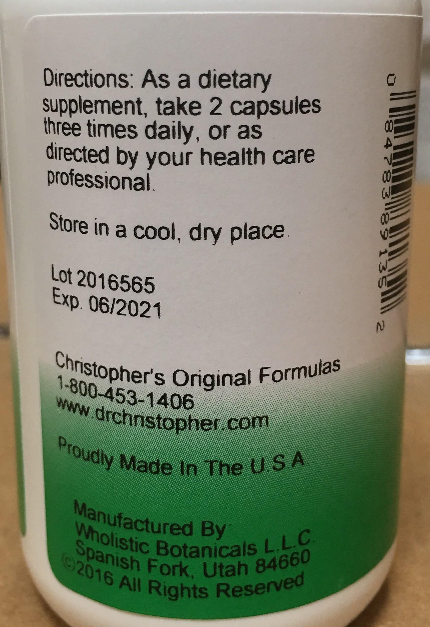 Christopher's Original Formulas cápsulas en mano para comparar tamaño y controlar la porción