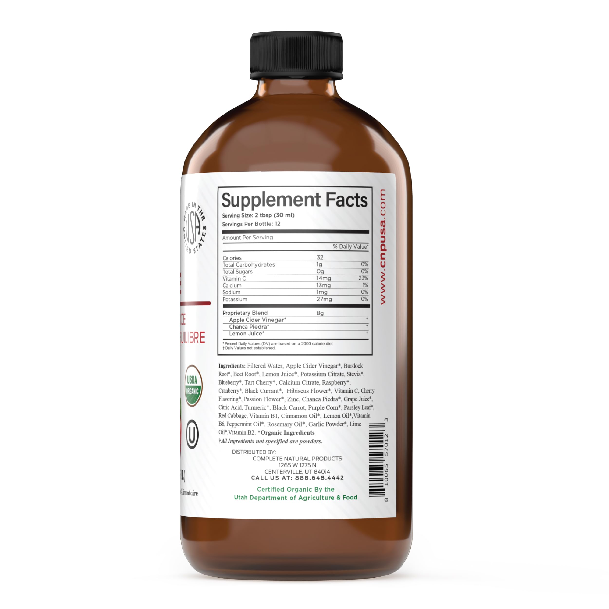 Complete Natural Products botella sobre encimera en ambiente de cocina saludable