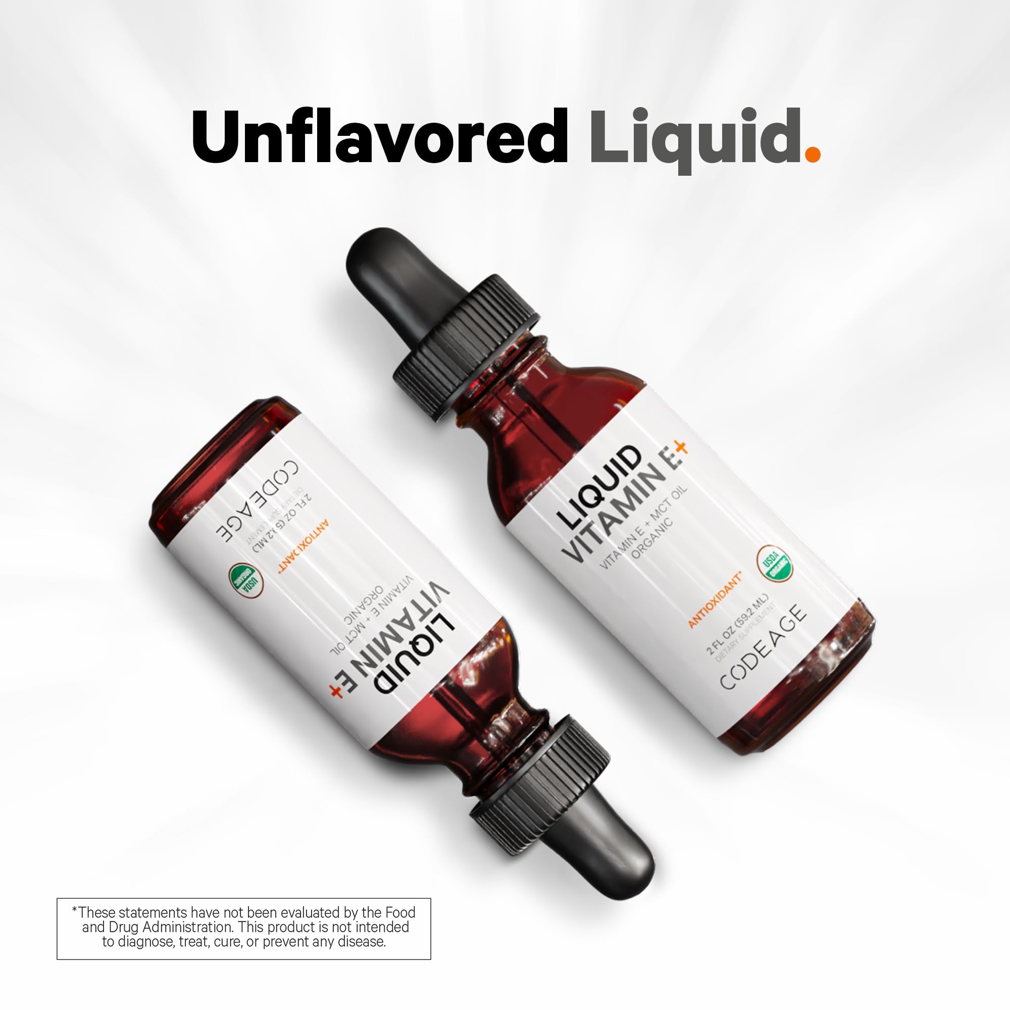 Codeage botella junto a naranja para indicar aceite de fruta orgánico