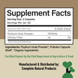 Complete Natural Products cápsulas junto a un vaso de agua para facilidad