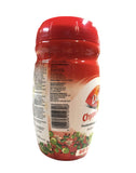 Dabur comparación de tamaño del frasco 500 g junto a utensilios de cocina