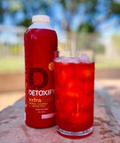 Detoxify envase con sticker inclusivo destacando valor añadido del paquete