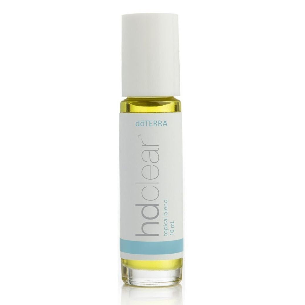 doTERRA HD Clear envase frontal muestra aplicador y piel más clara