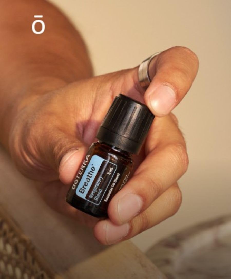 doTERRA frasco de 15 ml junto a objeto para mostrar tamaño y conveniencia