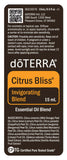 doTERRA Citrus Bliss comparado con una moneda para apreciar tamaño práctico